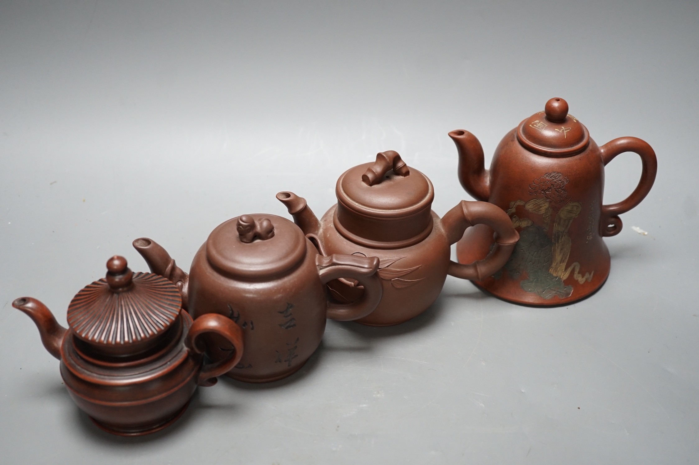 Four Chinese Yixing teapots, tallest 13cm